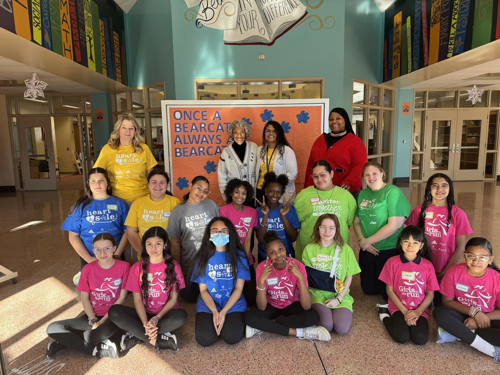 Group of students and adults smiling