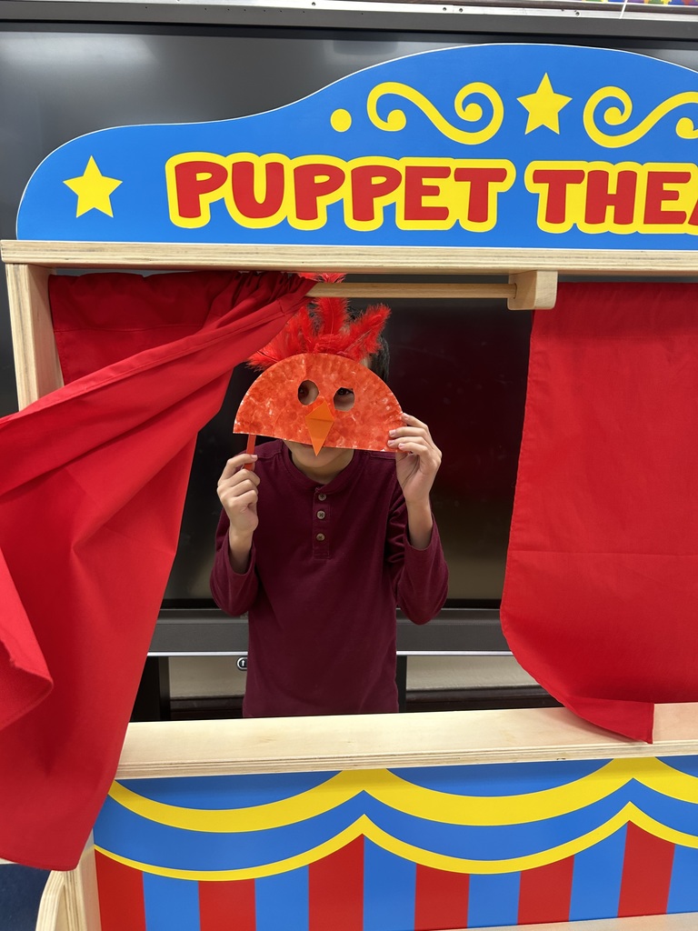 Student holding up a mask