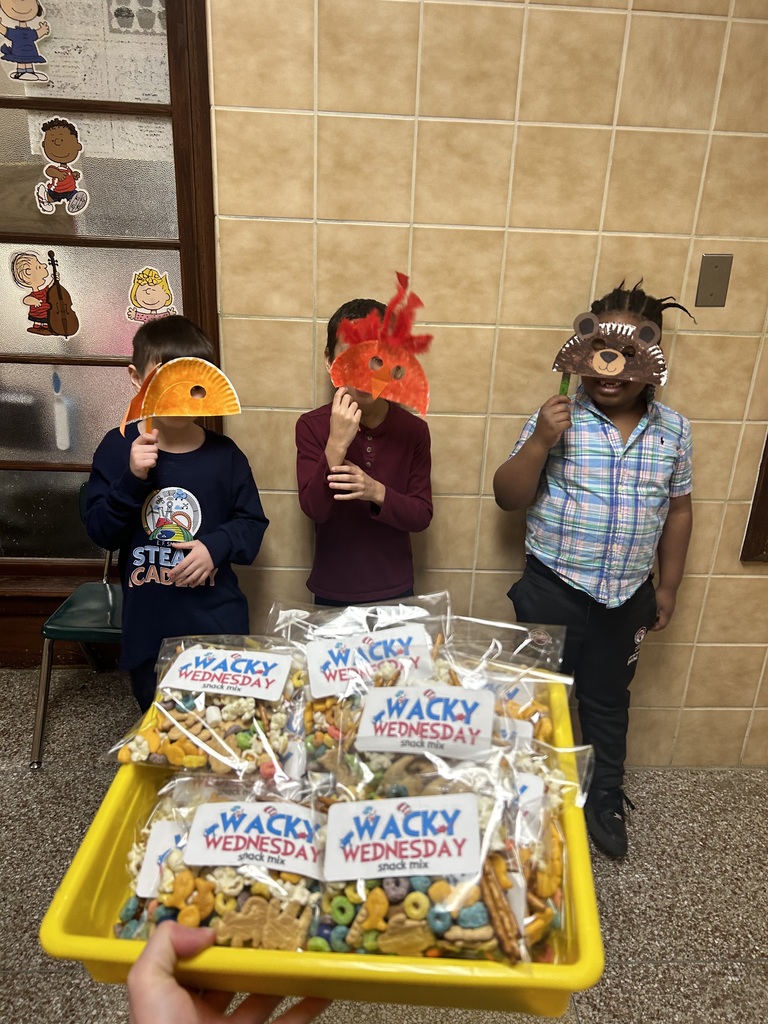 Student holding up a mask