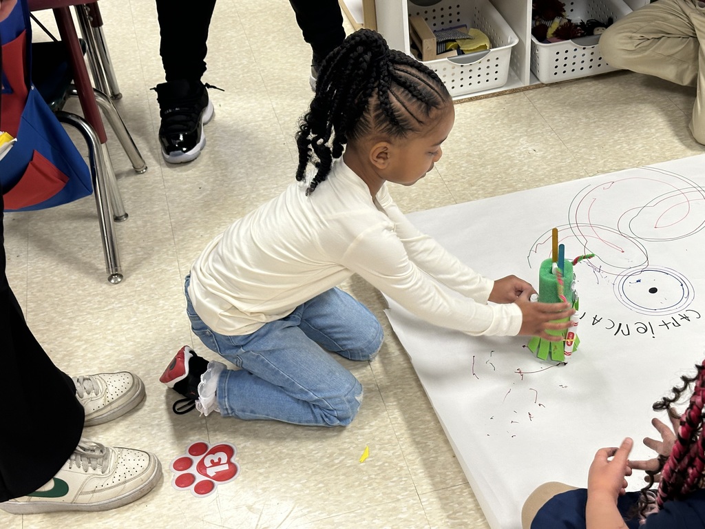 A student holding a project