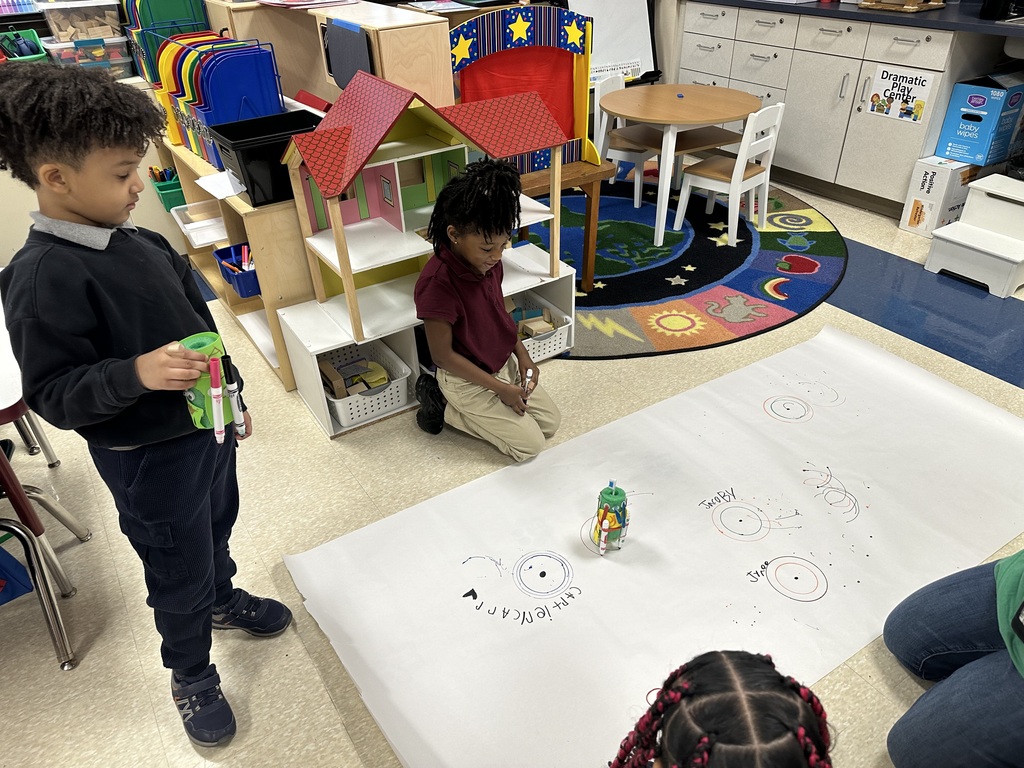 Two students looking at a piece of paper