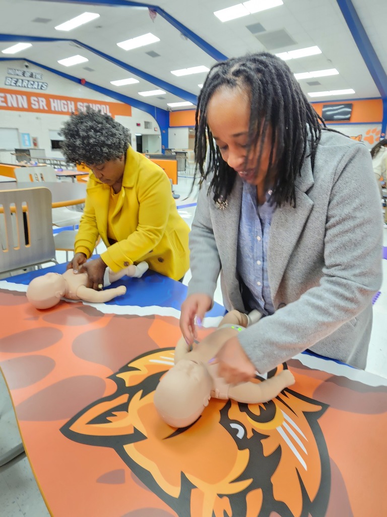 Two people performing CPR