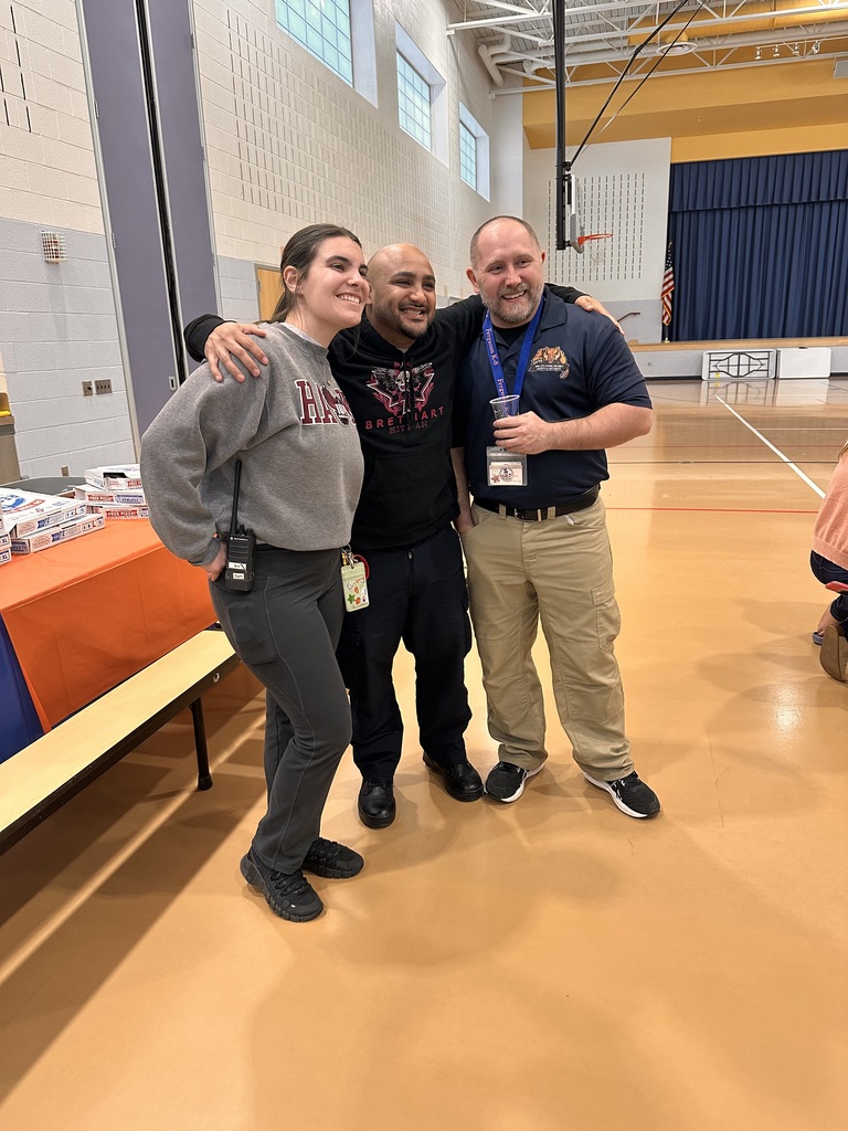 Three people smiling