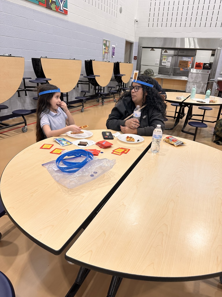 A student and adult playing a game