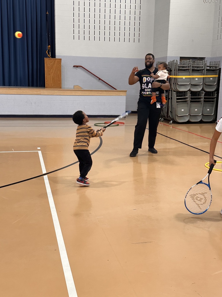 An adult with two small children