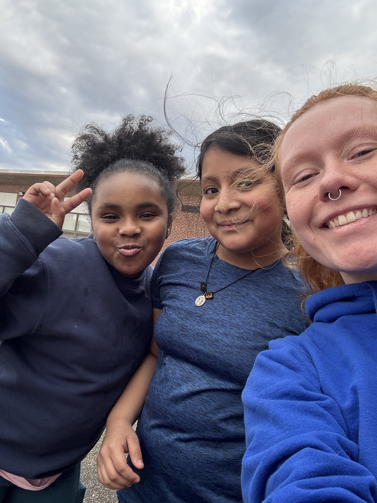 Three people smiling for a photo