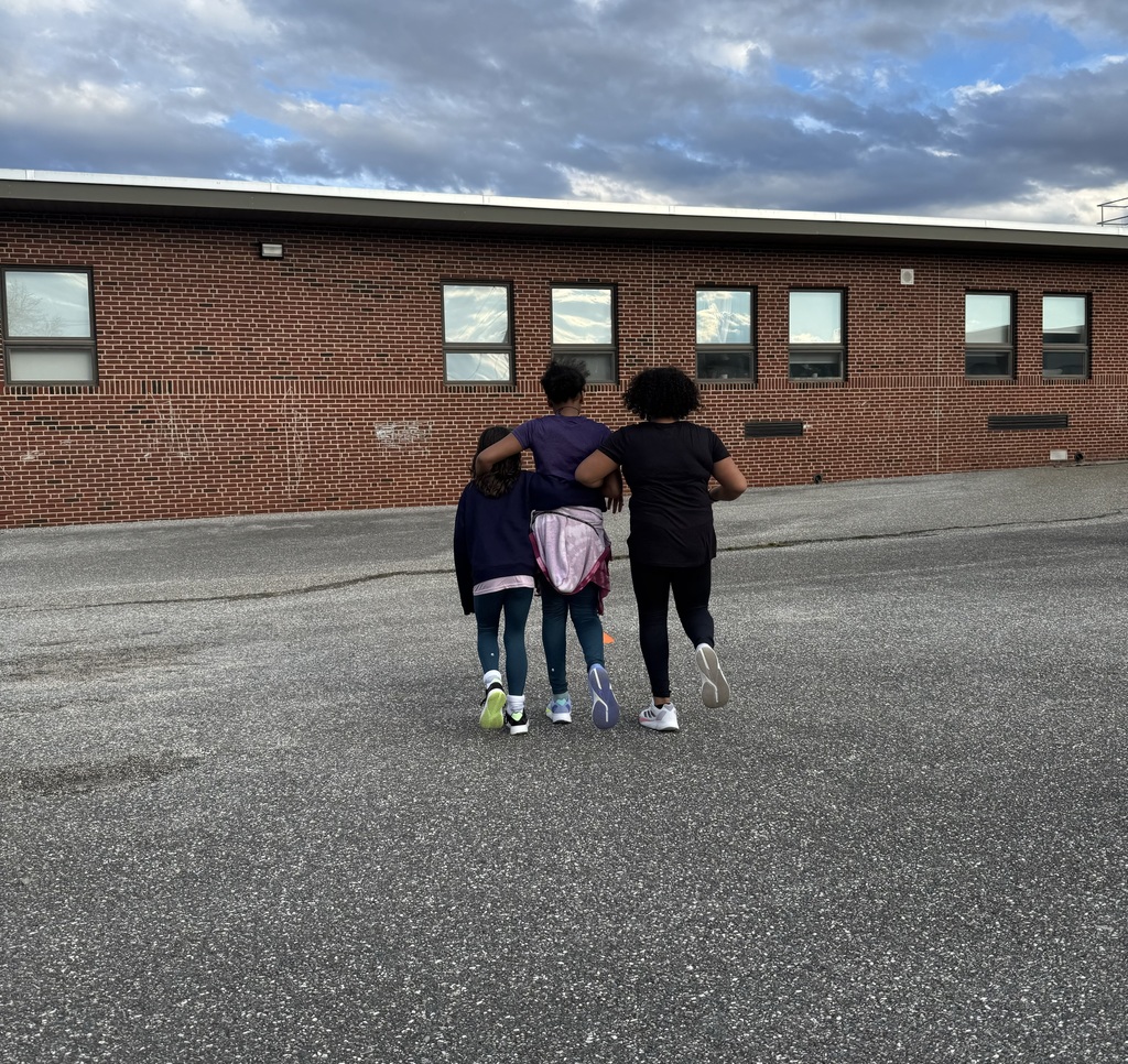 Three people with their backs turned to the camera