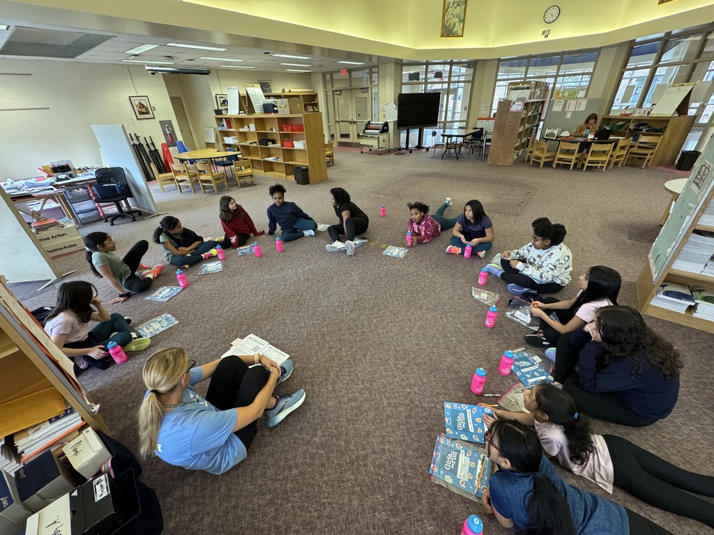 Group of people sitting in a circle