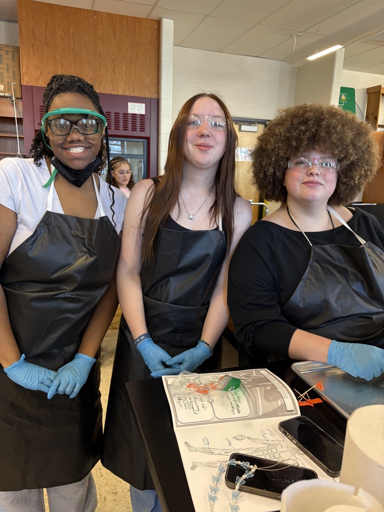 Three students working on a project