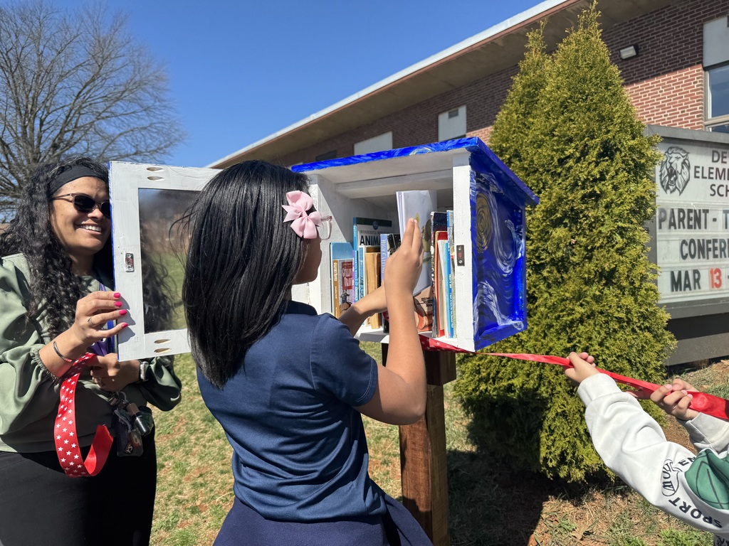 A student grabbing a book