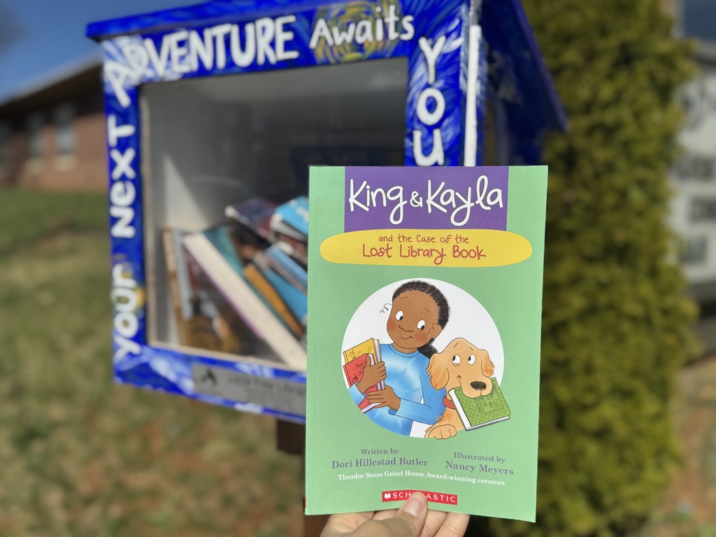 A person holding up a book