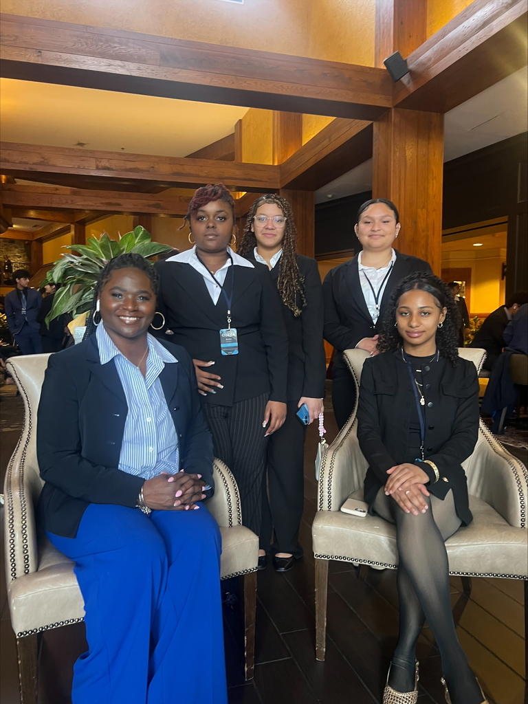 Group of people sitting and smiling