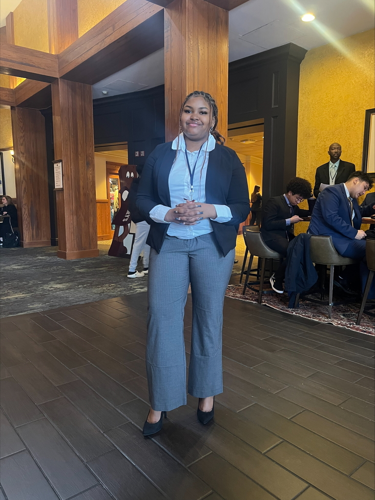 A student standing and posing