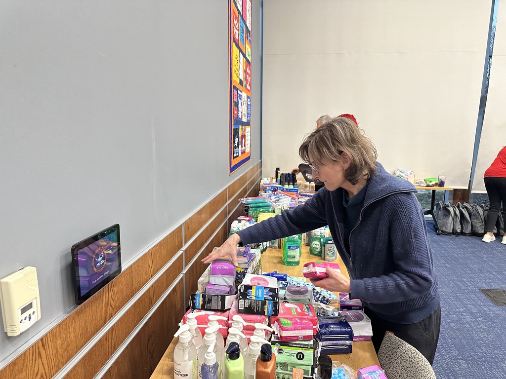 A person grabbing a product