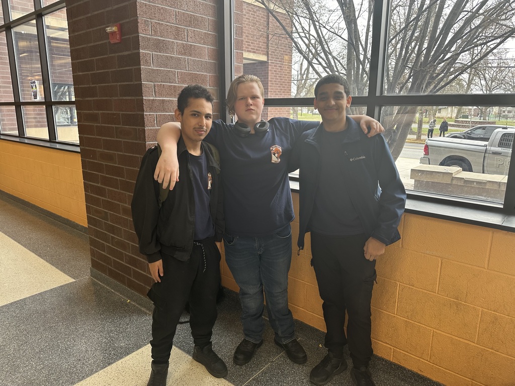 Three students posing for a group photo