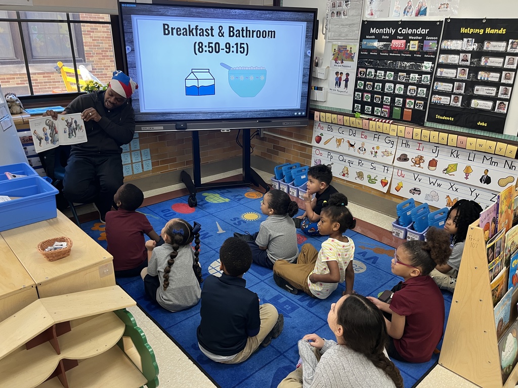 Adult reading to students 