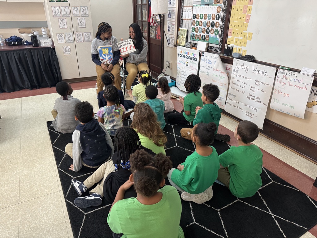 Students reading to other students
