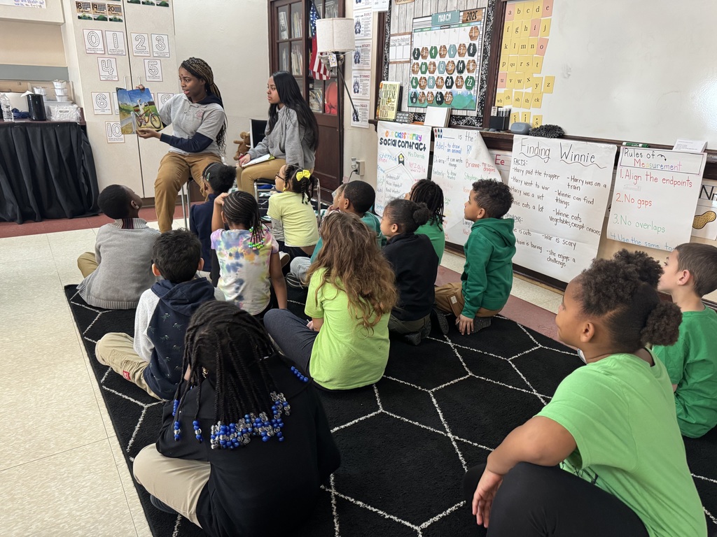 Students reading to other students