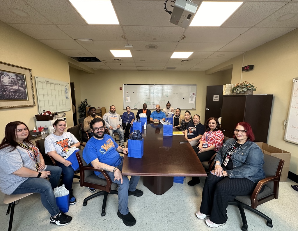 National Bilingual/Multilingual Month - Group of staff members smiling 