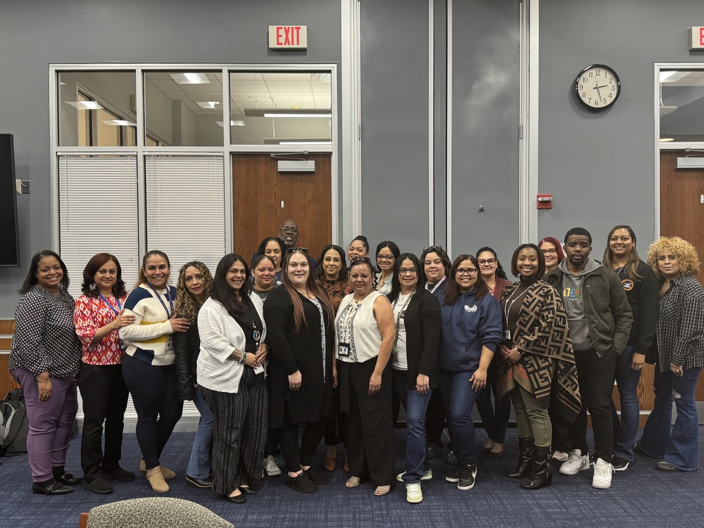 National Bilingual/Multilingual Month - Group of staff members smiling