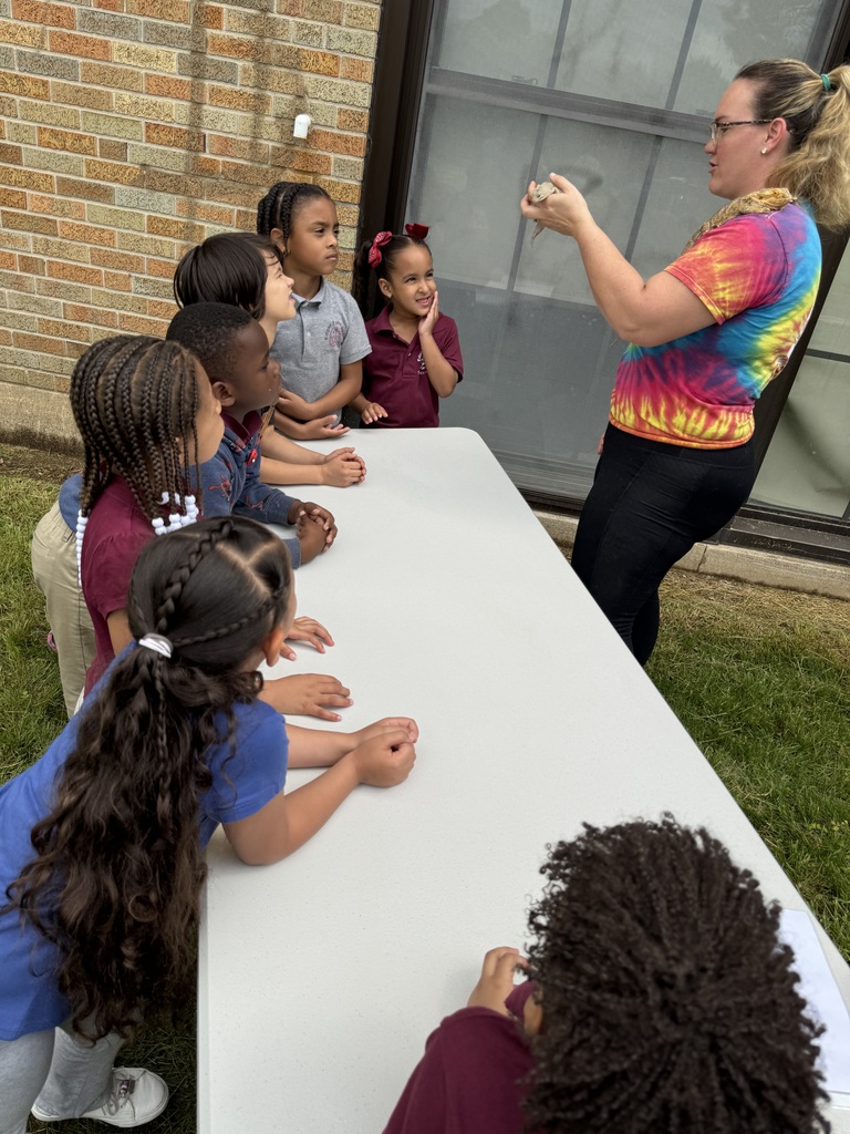 Students experiencing a petting zoo