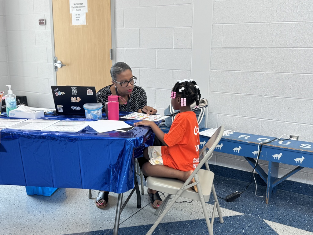 A Ferguson PreK-8 staff member and an incoming Kindergarten student are working on a paper together during Ferguson PreK-8's recent Kindergarten Orientation event.