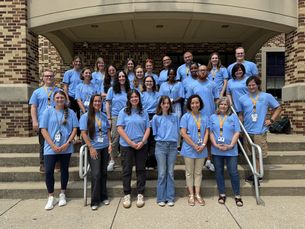 New teachers and staff in front of Smith STEAM Academy