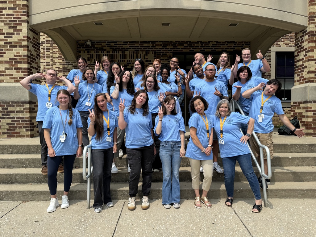 New teachers and staff in front of Smith STEAM Academy