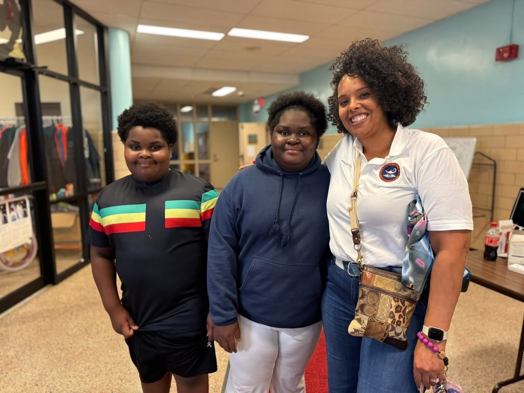 Devers Principal, Dr. Hanson with two students at Devers PreK-8's Back to School Night.