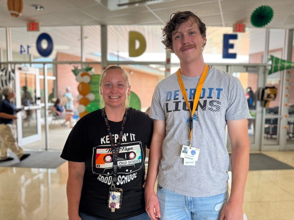 Two district staff members posing for a photo at Goode PreK-8's Back to School Night.