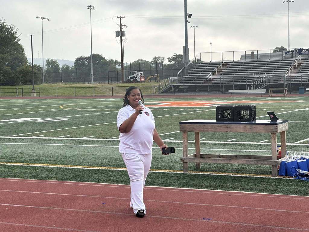 Superintendent, Dr. Andrea Berry-Brown holding a microphone at the School District of the City of York's 2025-2026 Opening Kick-Off Day.