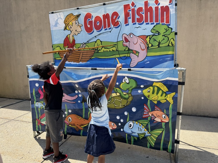 Two children playing fish games.