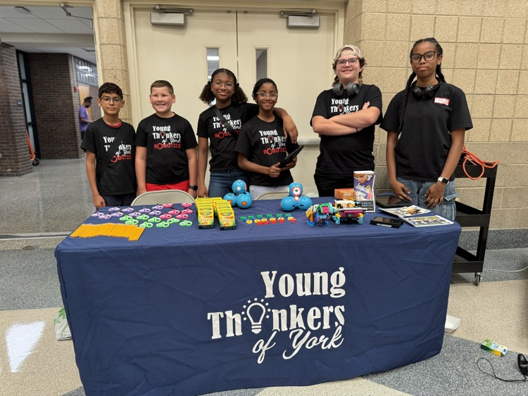Six children sitting at a table called Young Thinkers of York.