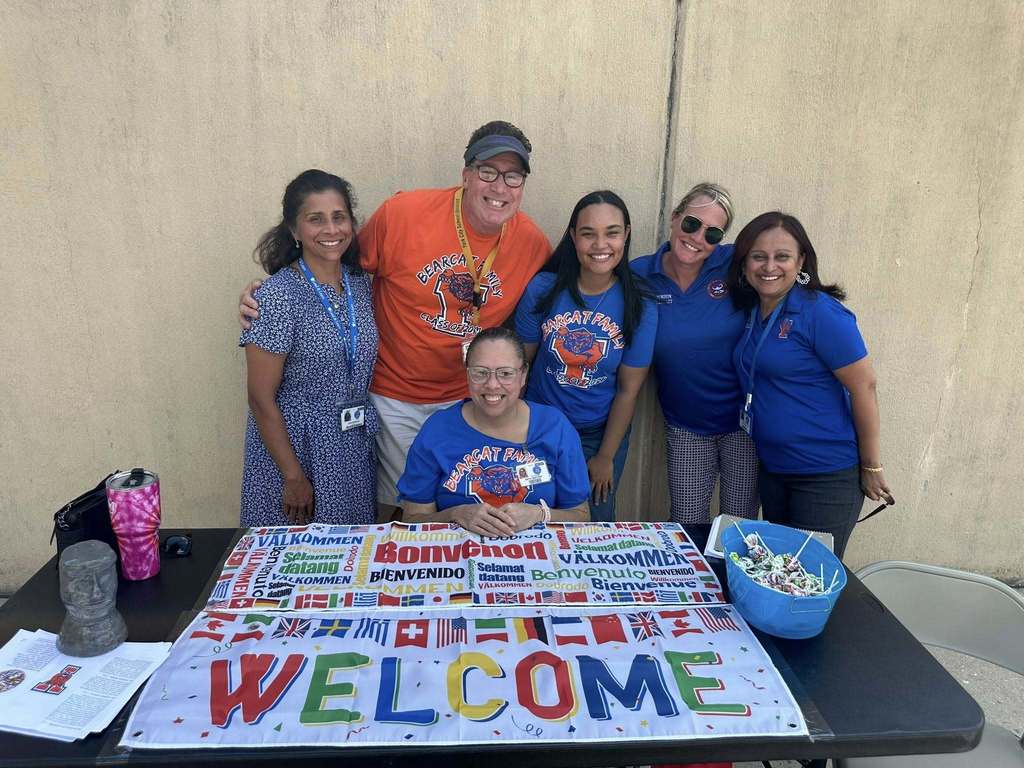 English Language Development Department at William Penn Senior High School's Back to School night, standing next to their table.