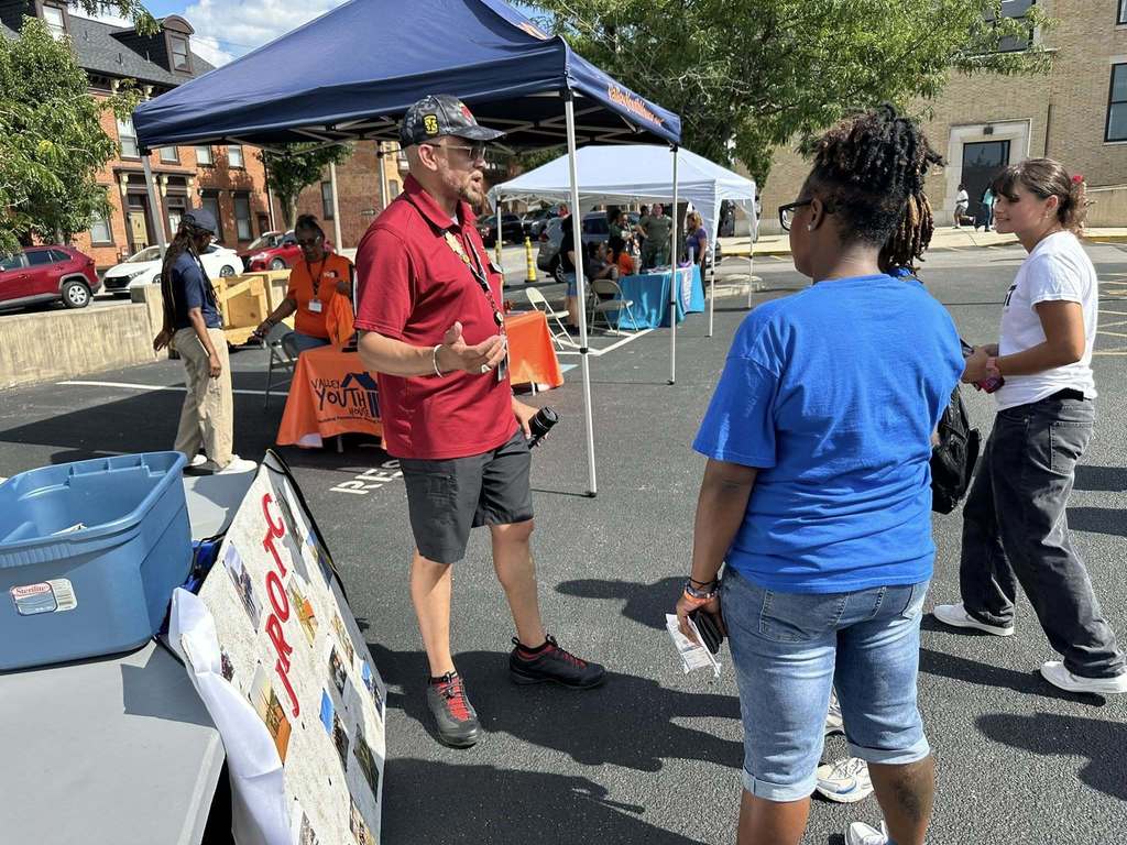 JROTC Department at William Penn Senior High School's Back to School night, standing next to their table.