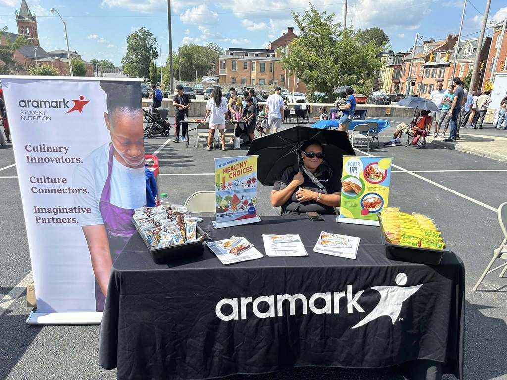 Food Services Department at William Penn Senior High School's Back to School night, standing next to their table.