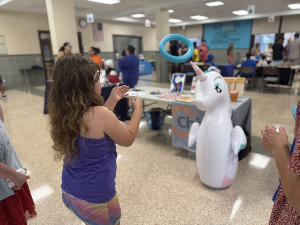 A student throwing a ring into the air. 