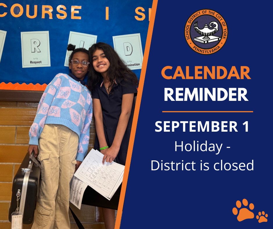 Two students posing together in front of a colorful backdrop with a calendar reminder about a school holiday on September 1.