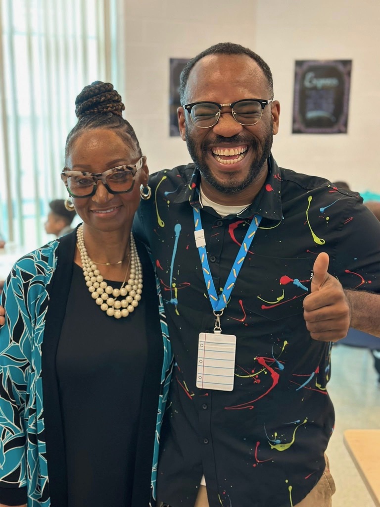 Ferguson PreK-8 Principal Ms. Love and a district staff member posing together for a photo.