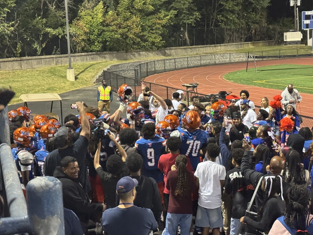 York High Football players and fans cheering at York High's recent Football Game.