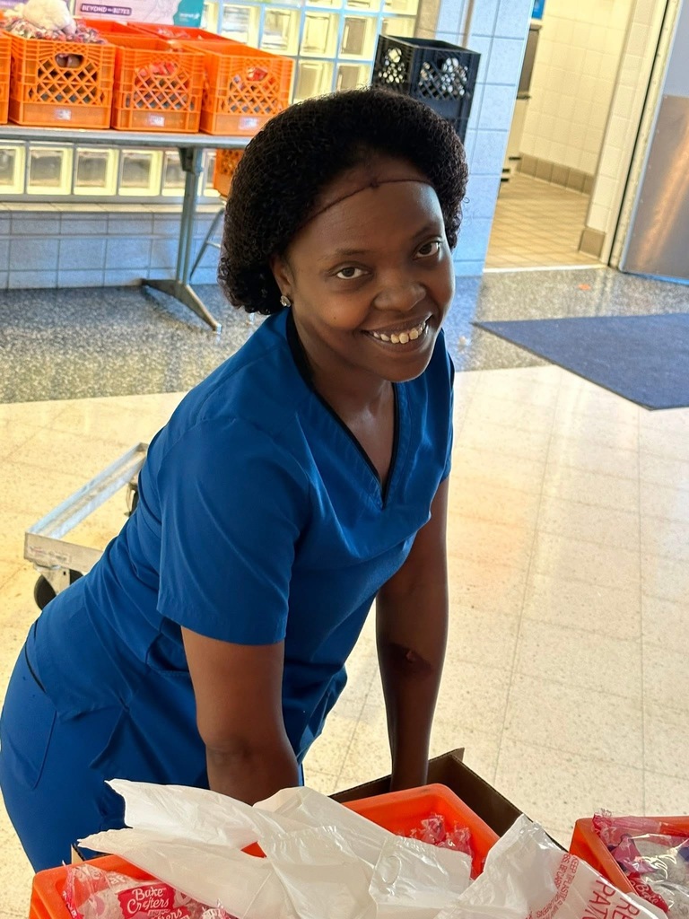 A district staff member smiling for a photo.