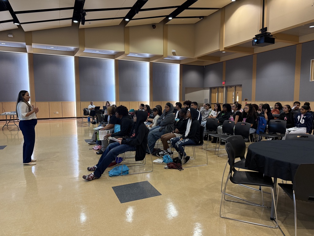 A group of William Penn Senior High School students listening to a lecture.