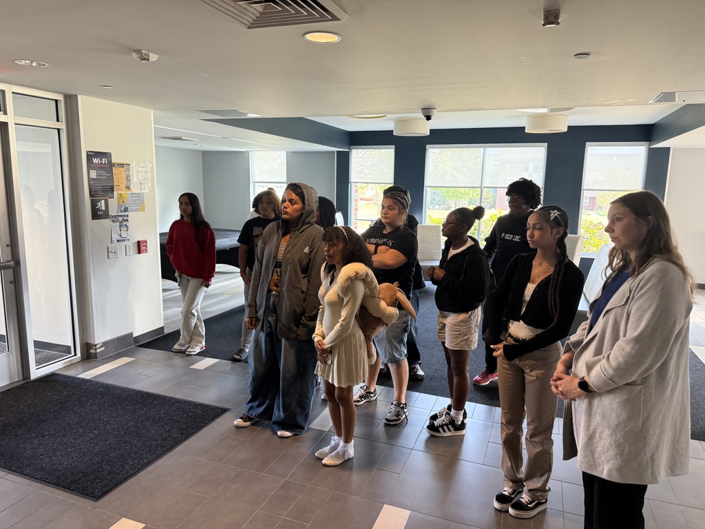 A group of William Penn Senior High School students listening to a lecture.