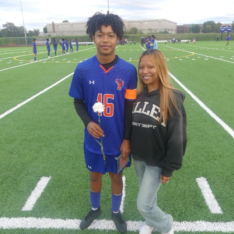 A York High Boys Soccer team player and a girl standing