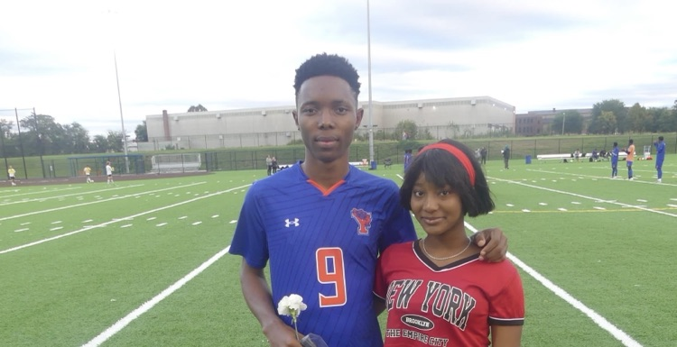 A York High Boys Soccer team player and a girl standing