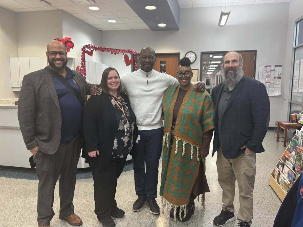 William Penn Senior High School Administration, consisting of two women and three men are standing together in a lobby area.