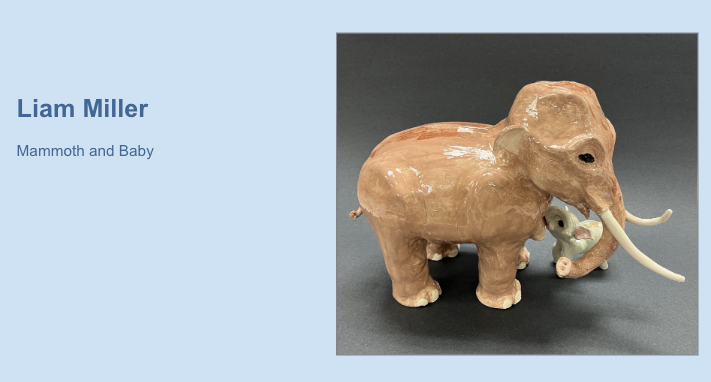 Artwork titled "Mammoth and Baby" by student Liam Miller, featuring a clay sculpture of a large brown mammoth with long tusks and a small baby mammoth beneath it on a dark background.