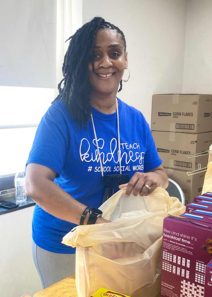 Social worker volunteering and packing a bag