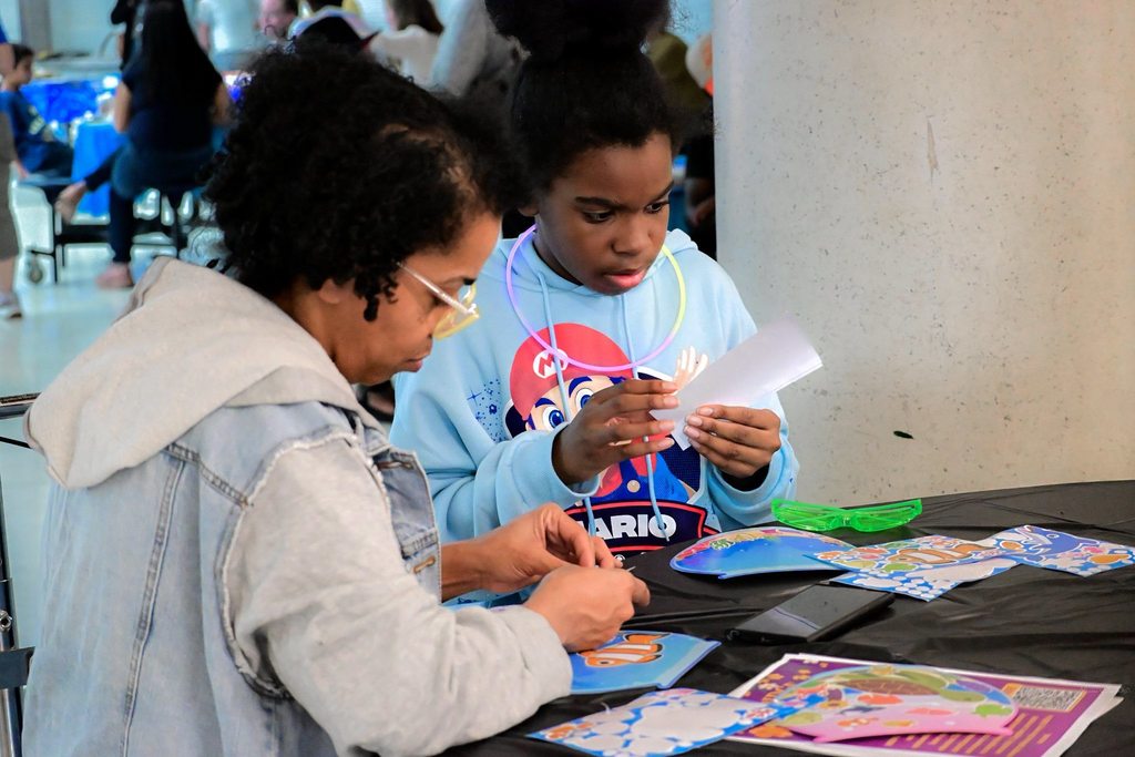 Hannah Penn PreK-8 students, families, and staff gathered in Hannah Penn PreK-8's school cafeteria for a Family Engagement event titled Harmony Night.