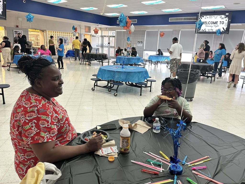 Hannah Penn PreK-8 students, families, and staff gathered in Hannah Penn PreK-8's school cafeteria for a Family Engagement event titled Harmony Night.